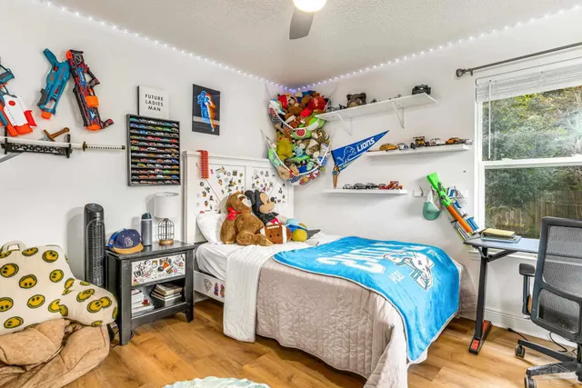 a bedroom with a bed and a window