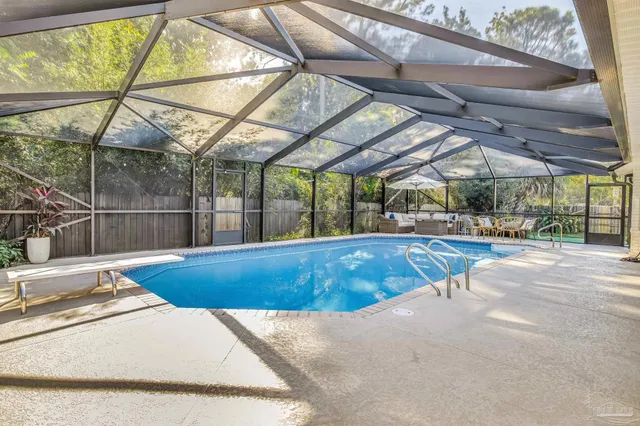 a view of a swimming pool with a patio