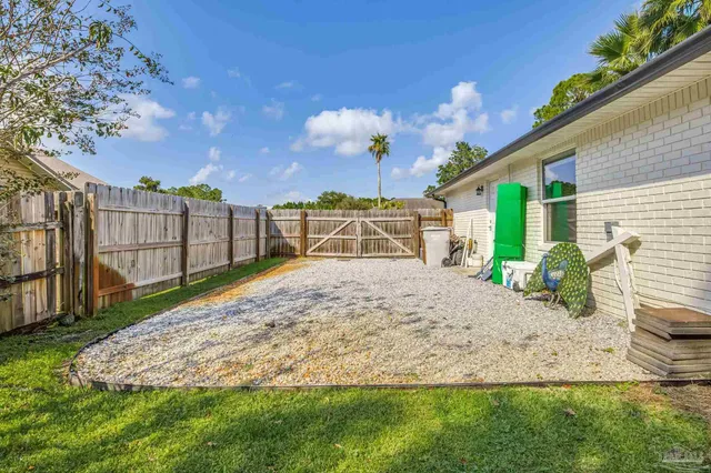 a backyard of a house with lots of green space