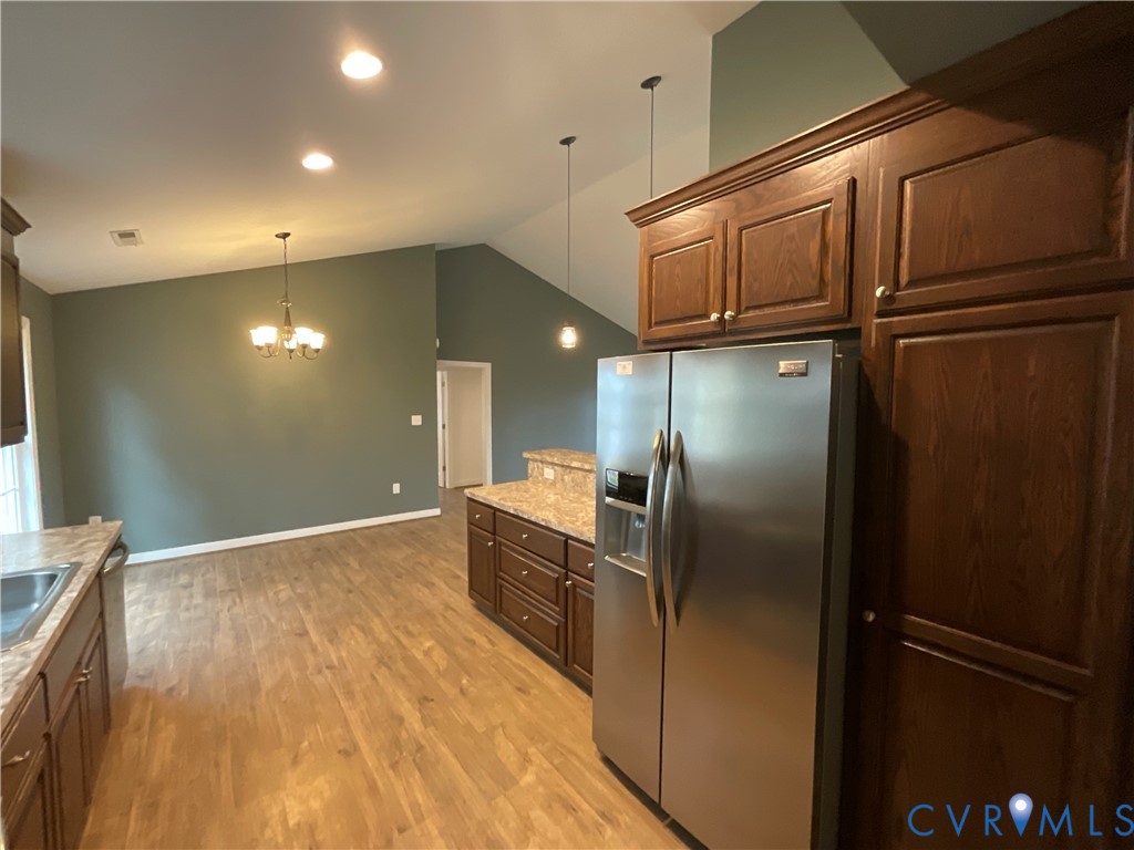 400 Elsassar Road King William, VA 23086 - Photo 11 of 31 a view of a refrigerator in kitchen and a wooden floor