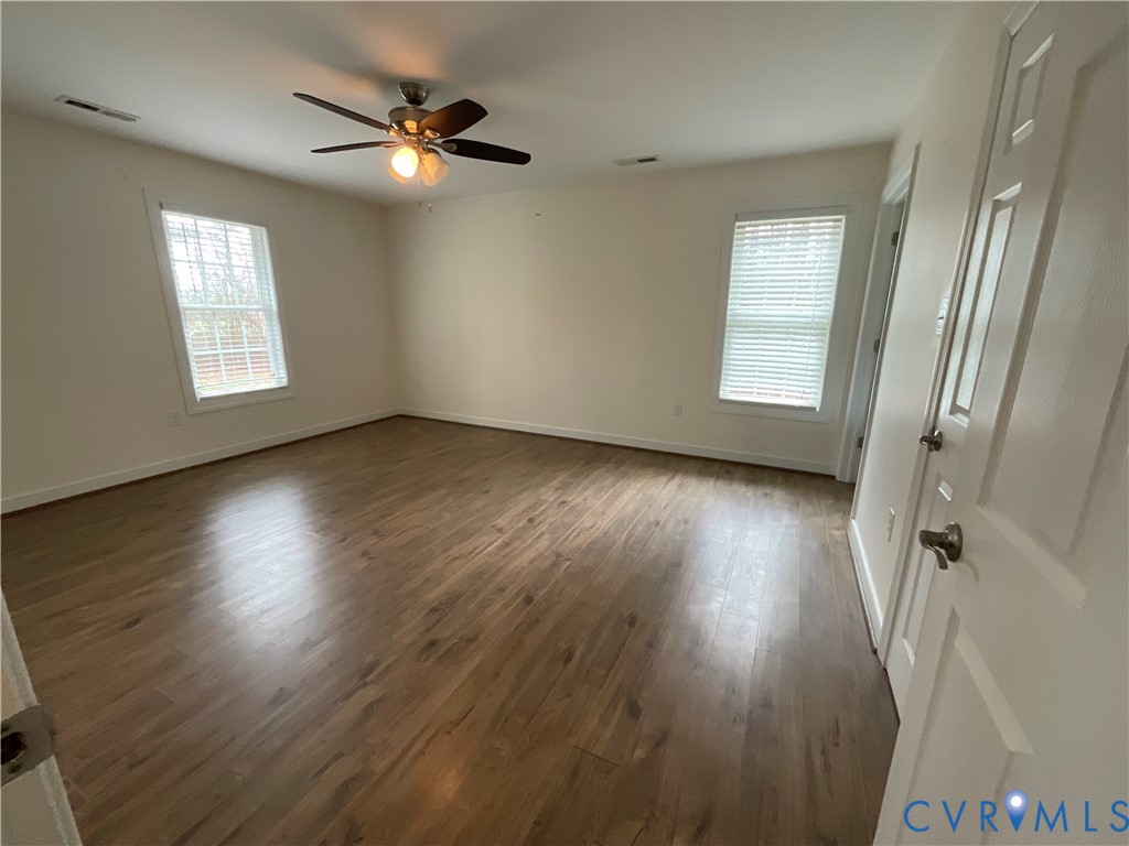 400 Elsassar Road King William, VA 23086 - Photo 12 of 31 a view of an empty room with wooden floor and a window