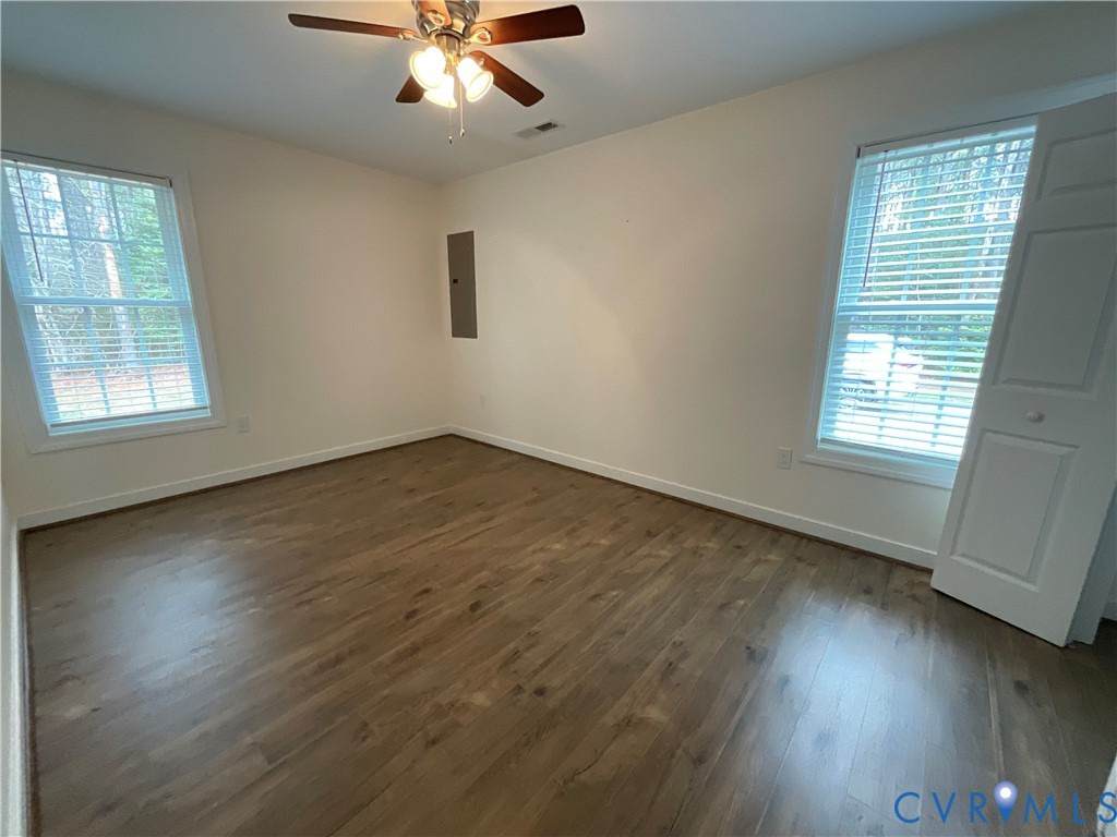 400 Elsassar Road King William, VA 23086 - Photo 15 of 31 a view of an empty room with wooden floor and a window