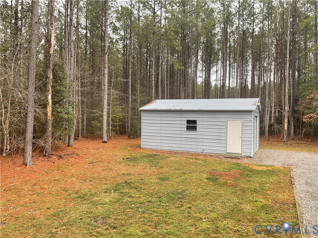400 Elsassar Road King William, VA 23086 - Photo 24 of 31 a backyard of a house with large trees and wooden fence