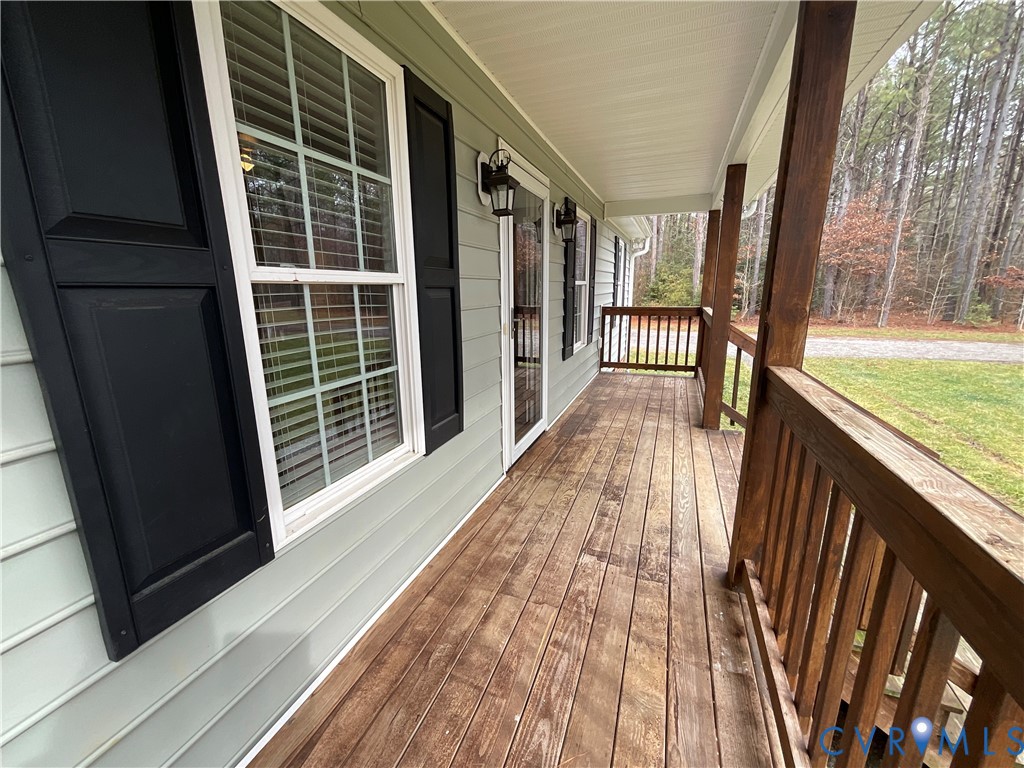 400 Elsassar Road King William, VA 23086 - Photo 4 of 31 a view of balcony with wooden floor and floor to ceiling window