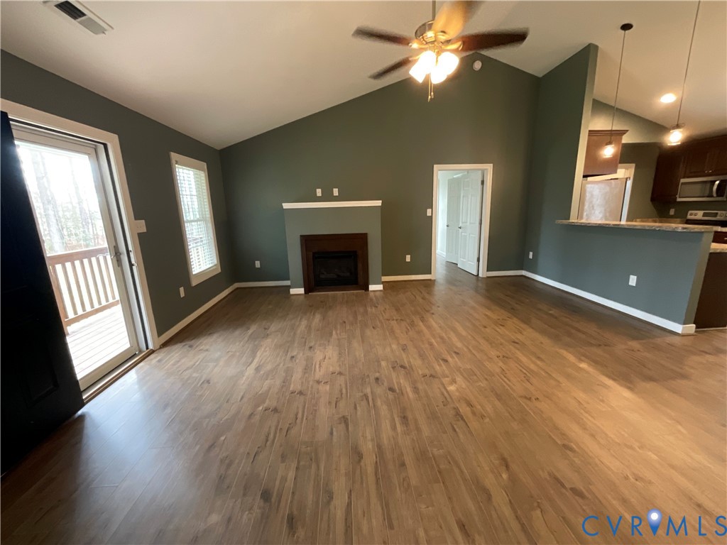 400 Elsassar Road King William, VA 23086 - Photo 6 of 31 a view of an empty room with window and wooden floor