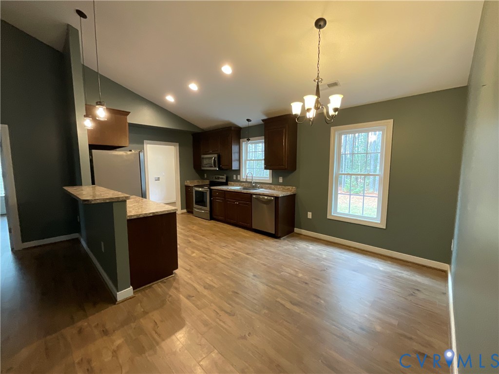 400 Elsassar Road King William, VA 23086 - Photo 8 of 31 a view of a kitchen with a sink and a microwave