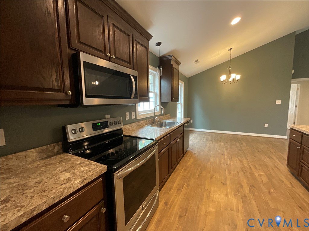 400 Elsassar Road King William, VA 23086 - Photo 10 of 31 a kitchen with a stove a sink and a microwave