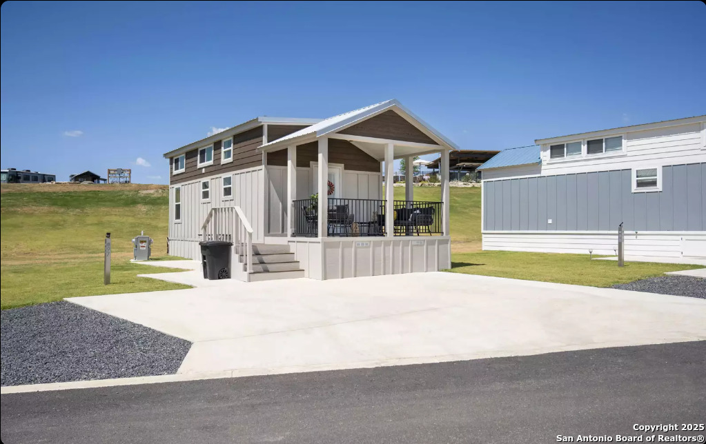 5386 Ranch Road 1376, Unit 97 Fredericksburg, TX 78624 - Photo 2 of 27 a view of house with outdoor space and sitting area