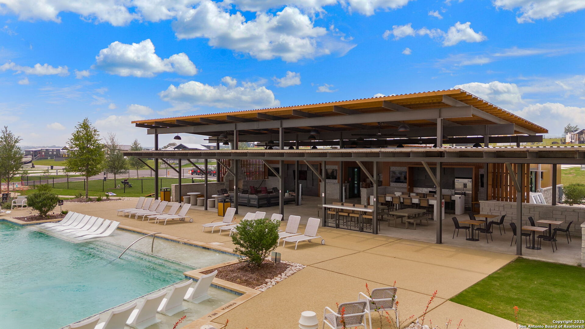 5386 Ranch Road 1376, Unit 97 Fredericksburg, TX 78624 - Photo 21 of 27 a view of a patio with chairs and tables