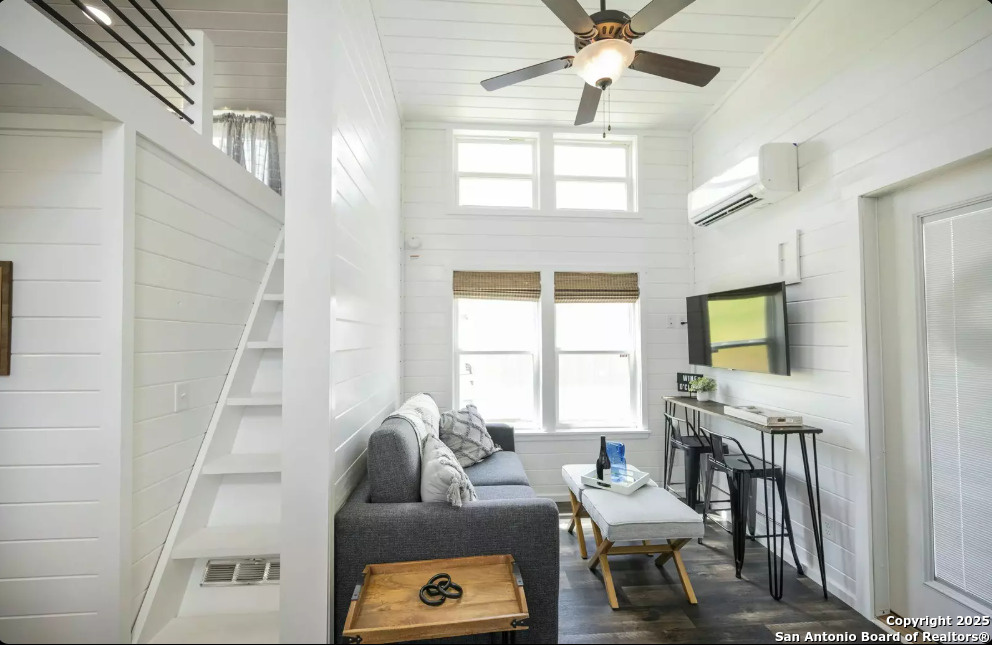 5386 Ranch Road 1376, Unit 97 Fredericksburg, TX 78624 - Photo 5 of 27 a living room with furniture and a flat screen tv