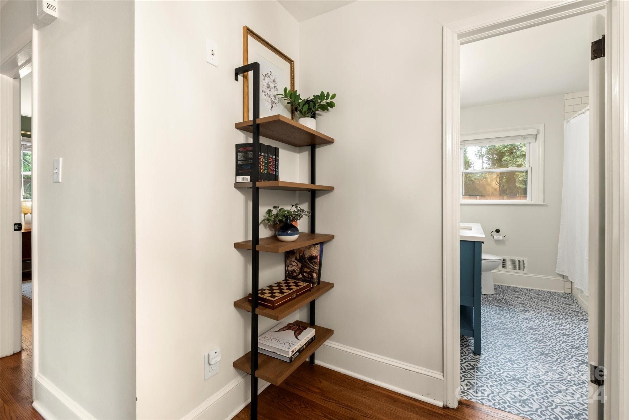 5822 Brookhaven Road Charlotte, NC 28210 - Photo 20 of 48 a view of hallway with wooden floor and stairs