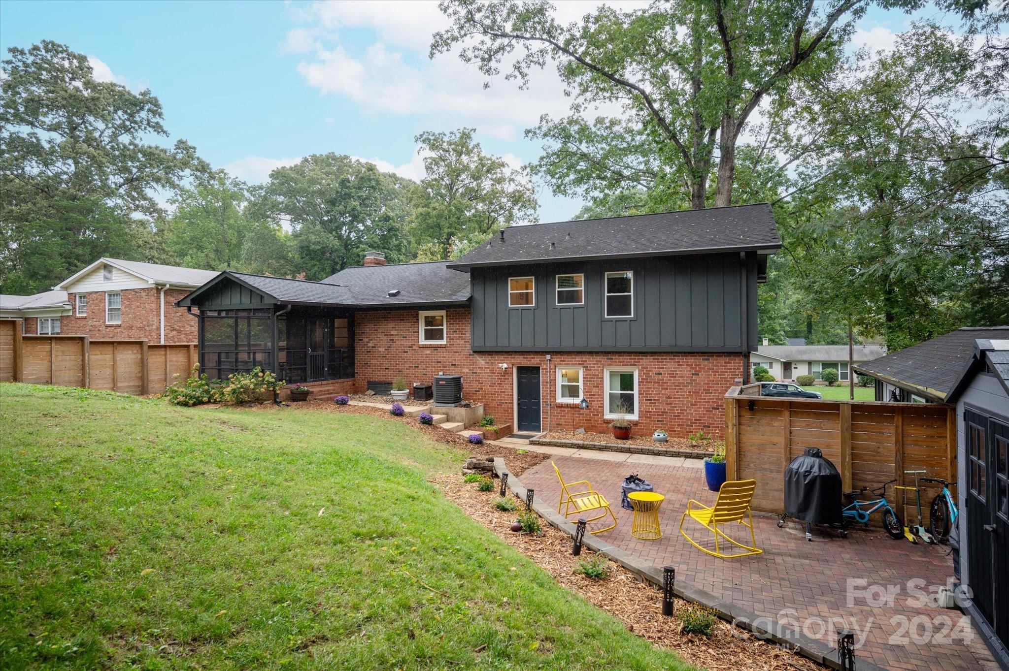 5822 Brookhaven Road Charlotte, NC 28210 - Photo 45 of 48 a view of a house with backyard and sitting area