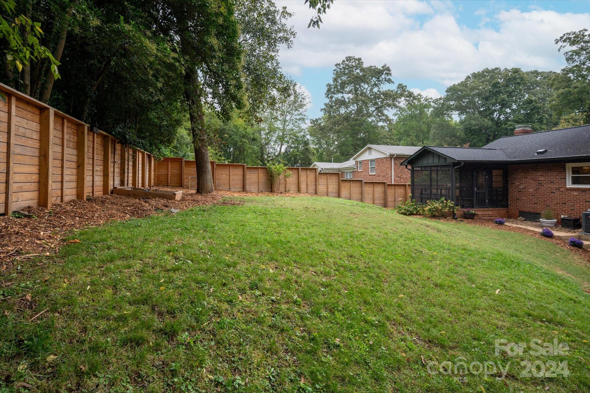 5822 Brookhaven Road Charlotte, NC 28210 - Photo 46 of 48 a view of a house with backyard and sitting area
