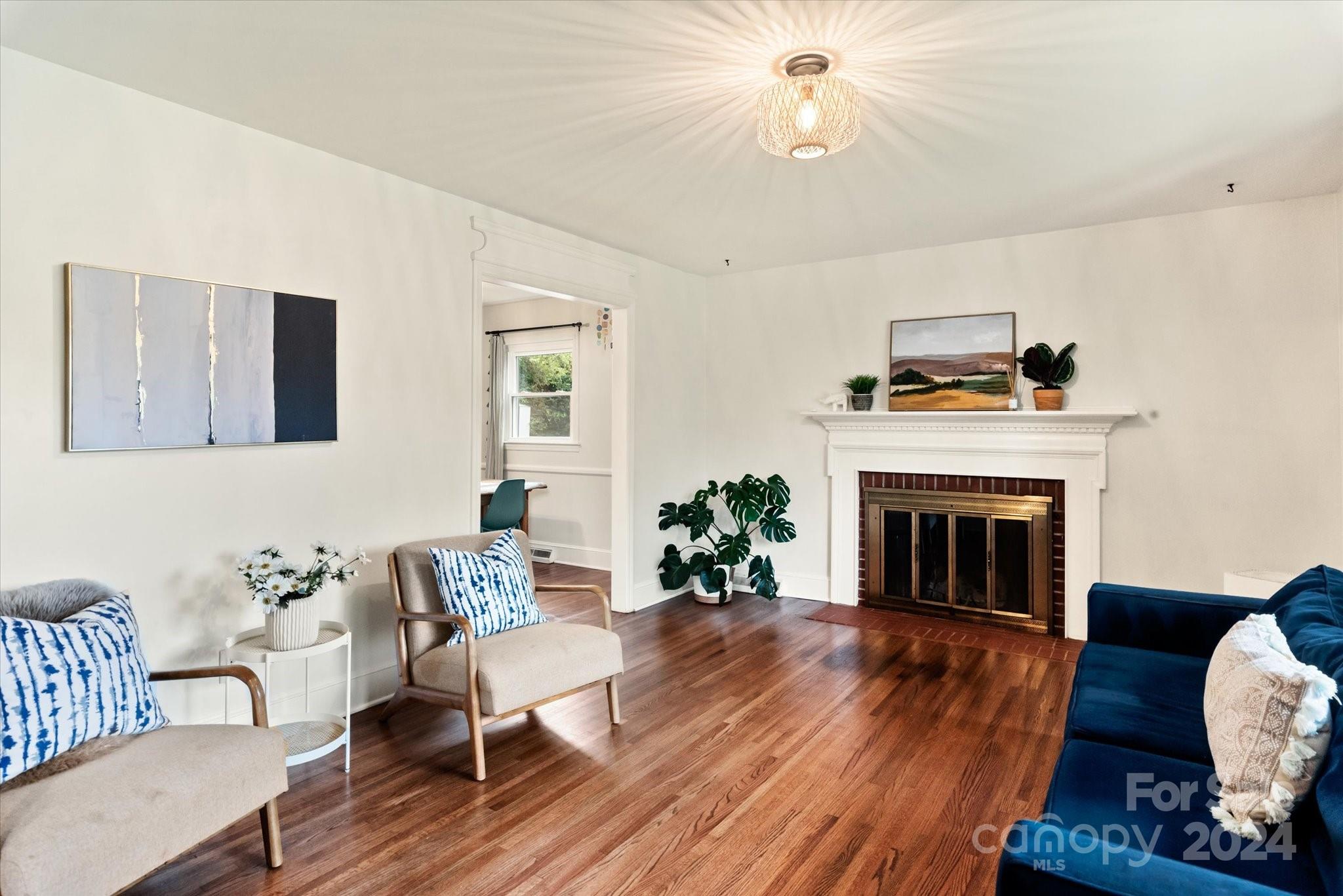 5822 Brookhaven Road Charlotte, NC 28210 - Photo 5 of 48 a living room with furniture and a fireplace