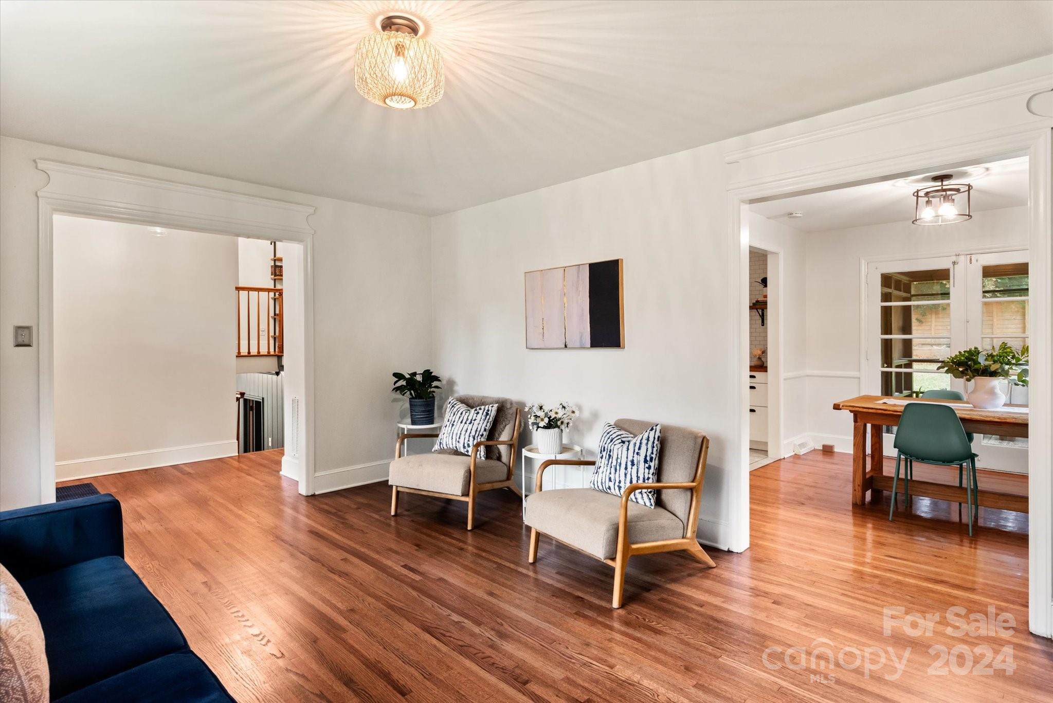 5822 Brookhaven Road Charlotte, NC 28210 - Photo 6 of 48 a living room with furniture a dining table and wooden floor