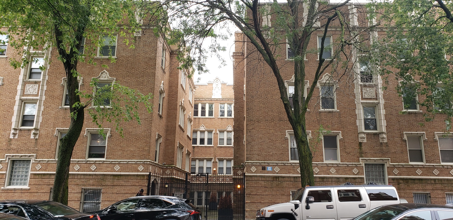 917 East 78th Street, Unit 101W Chicago, IL 60619 - Photo 1 of 8 a car parked in front of a building
