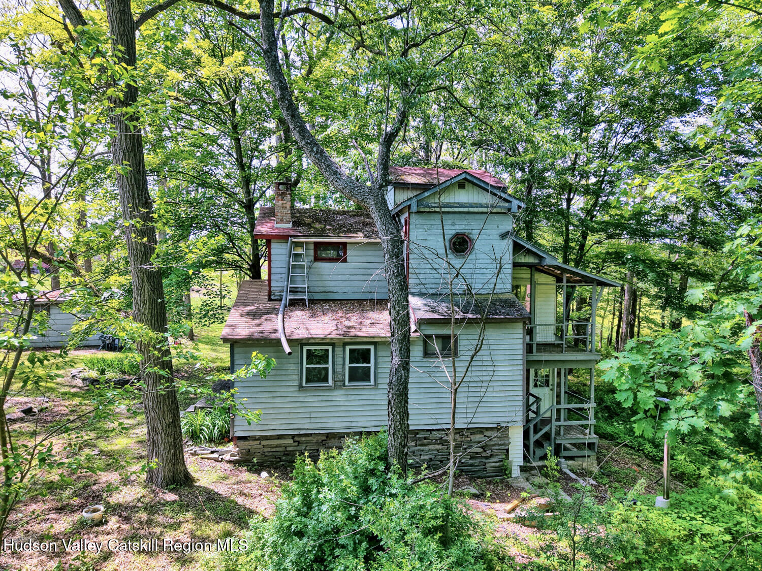 360 Stone Bridge Rd Extension East Durham, NY 12423 - Photo 64 of 83 front view of a house with a tree