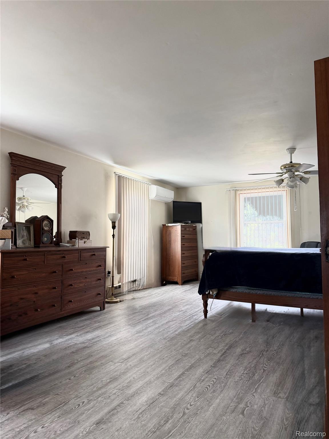 1412 South Byron Road Lennon, MI 48449 - Photo 11 of 22 Bedroom featuring light wood-style floors and a mini split for heating / cooling