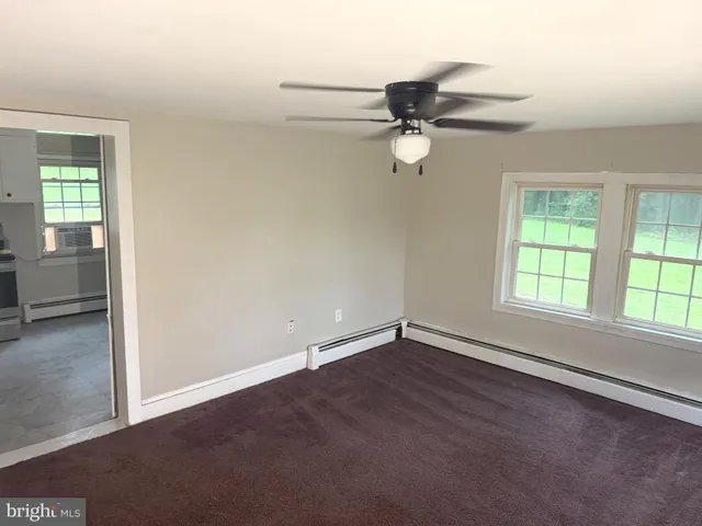 a bathroom with a shower and toilet