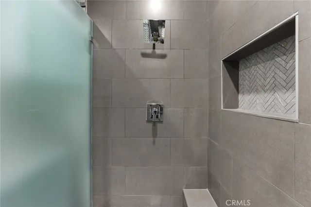 a bedroom with a bed and a view of bathroom