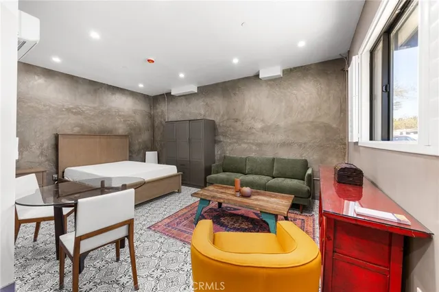 a living room with furniture and a rug