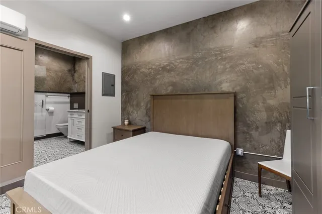 a large white bed in a white room