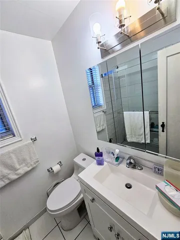 a kitchen with stainless steel appliances a sink a stove and a window