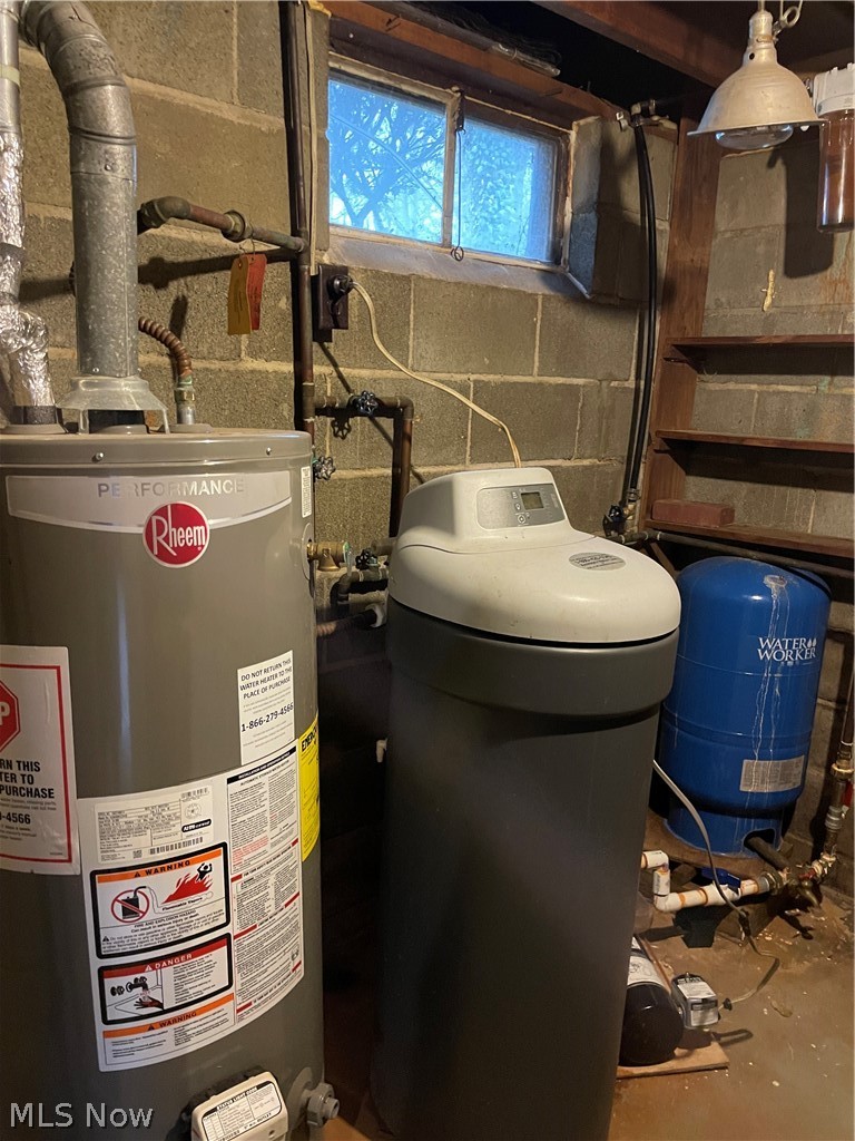 3025 Killian Road Uniontown, OH 44685 - Photo 16 of 23 Utility room featuring water heater