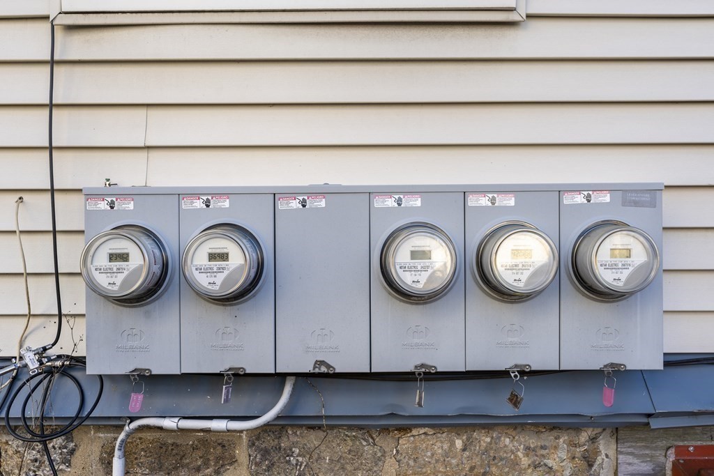 515 R Norfolk Street Boston, MA 02126 - Photo 20 of 26 a clock on a wall with a clock on the wall