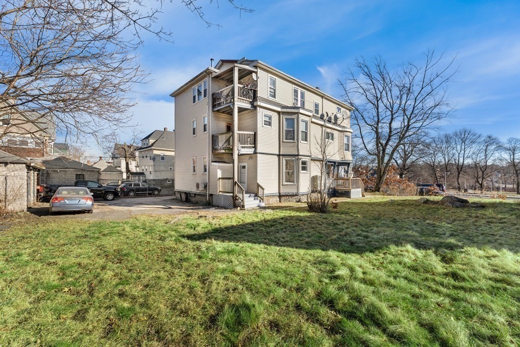 515 R Norfolk Street Boston, MA 02126 - Photo 2 of 26 a view of a house with a yard