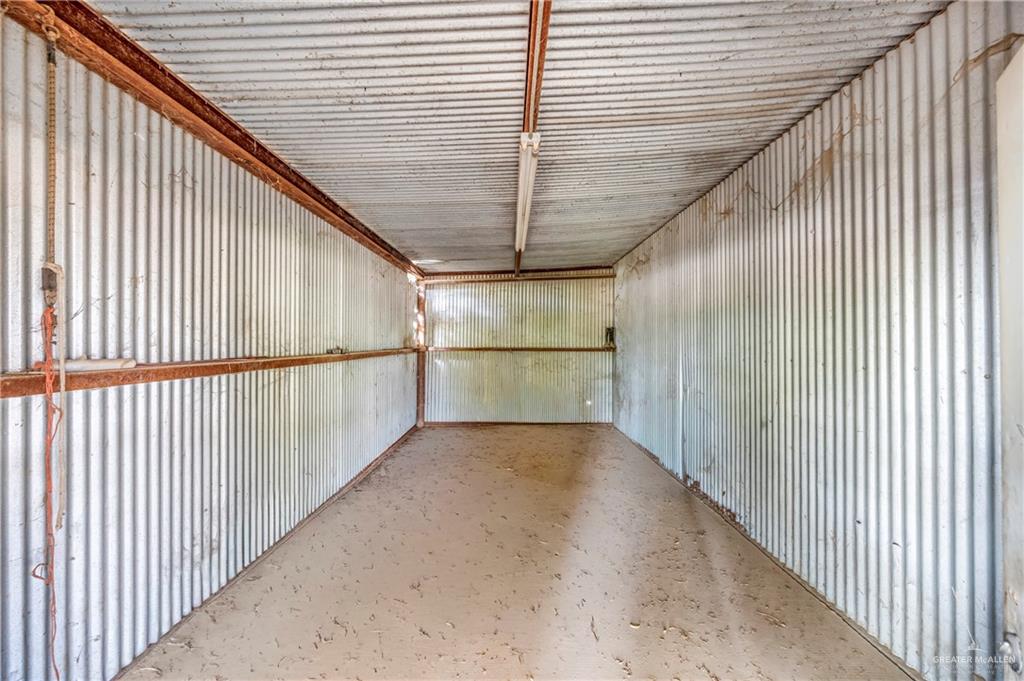 69 Zulema Street Rio Grande City, TX 78582 - Photo 15 of 26 a view of a hallway with wooden floor