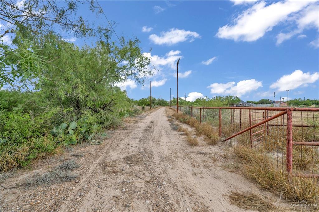 69 Zulema Street Rio Grande City, TX 78582 - Photo 18 of 26 a view of a pathway with a wrought fence