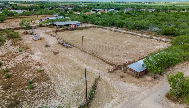 an aerial view of a yard with horses