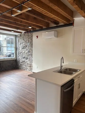 a kitchen with a sink and cabinets