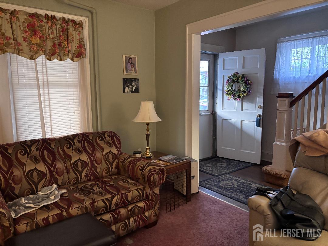 490 Mckeon Street Perth Amboy, NJ 08861 - Photo 13 of 28 a bedroom with a bed couch and window