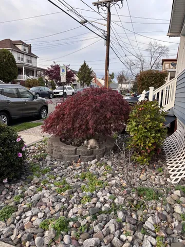 a view of a street with some cars parked on road