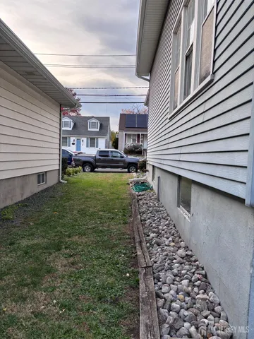 a view of a house with backyard porch and furniture