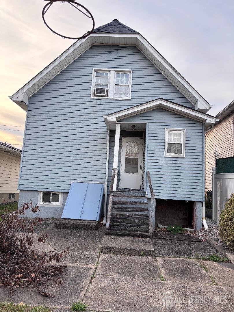 490 Mckeon Street Perth Amboy, NJ 08861 - Photo 26 of 28 a front view of a house with a yard