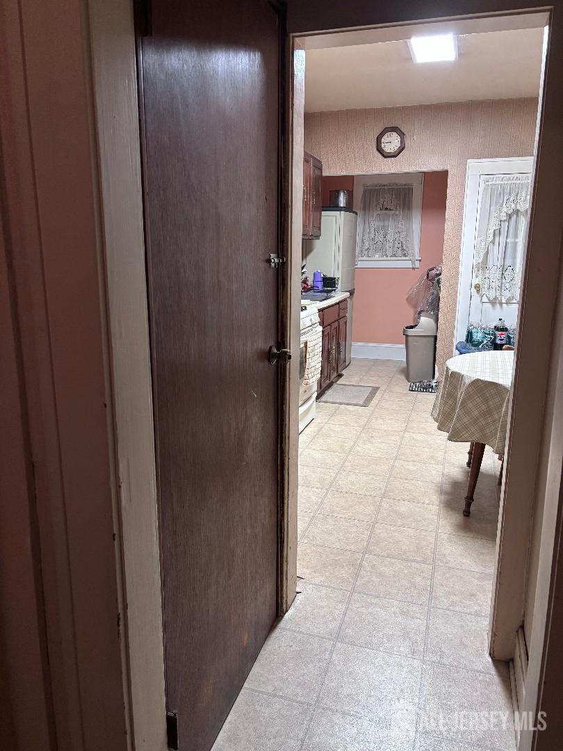 490 Mckeon Street Perth Amboy, NJ 08861 - Photo 3 of 28 a living room with furniture and a gate