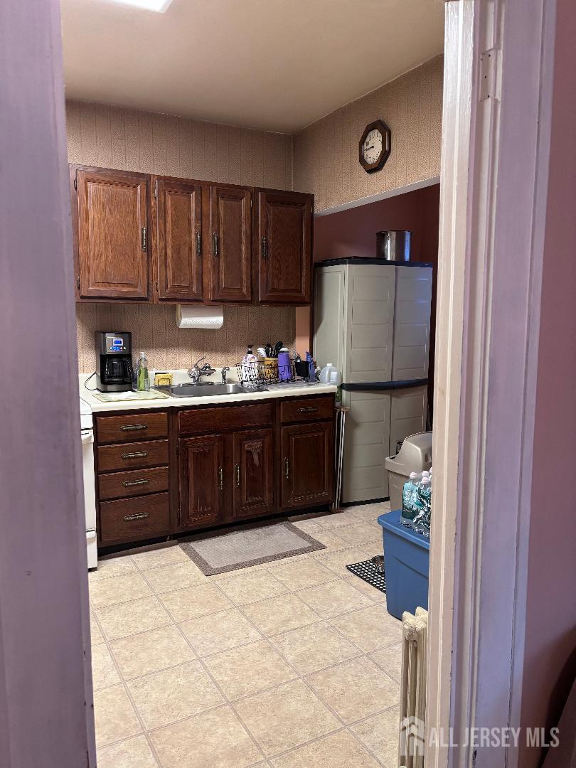 490 Mckeon Street Perth Amboy, NJ 08861 - Photo 5 of 28 a kitchen with a sink and cabinets