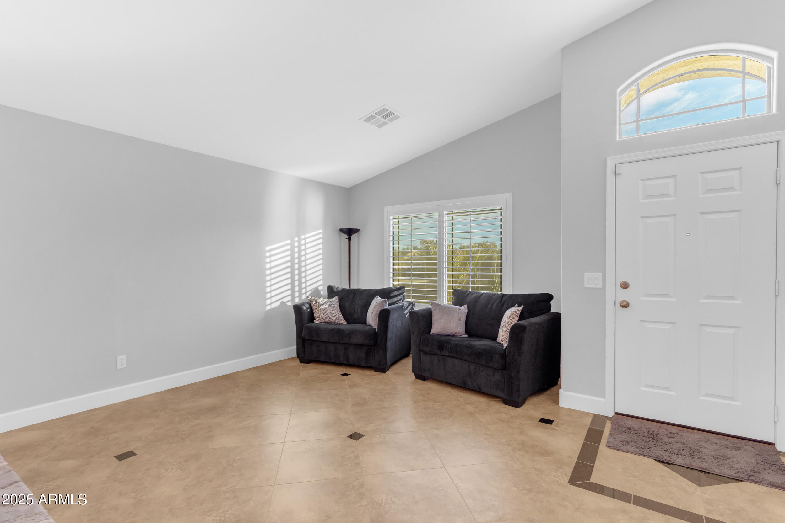 13438 West Redfield Road Surprise, AZ 85379 - Photo 13 of 75 a living room with furniture and a window