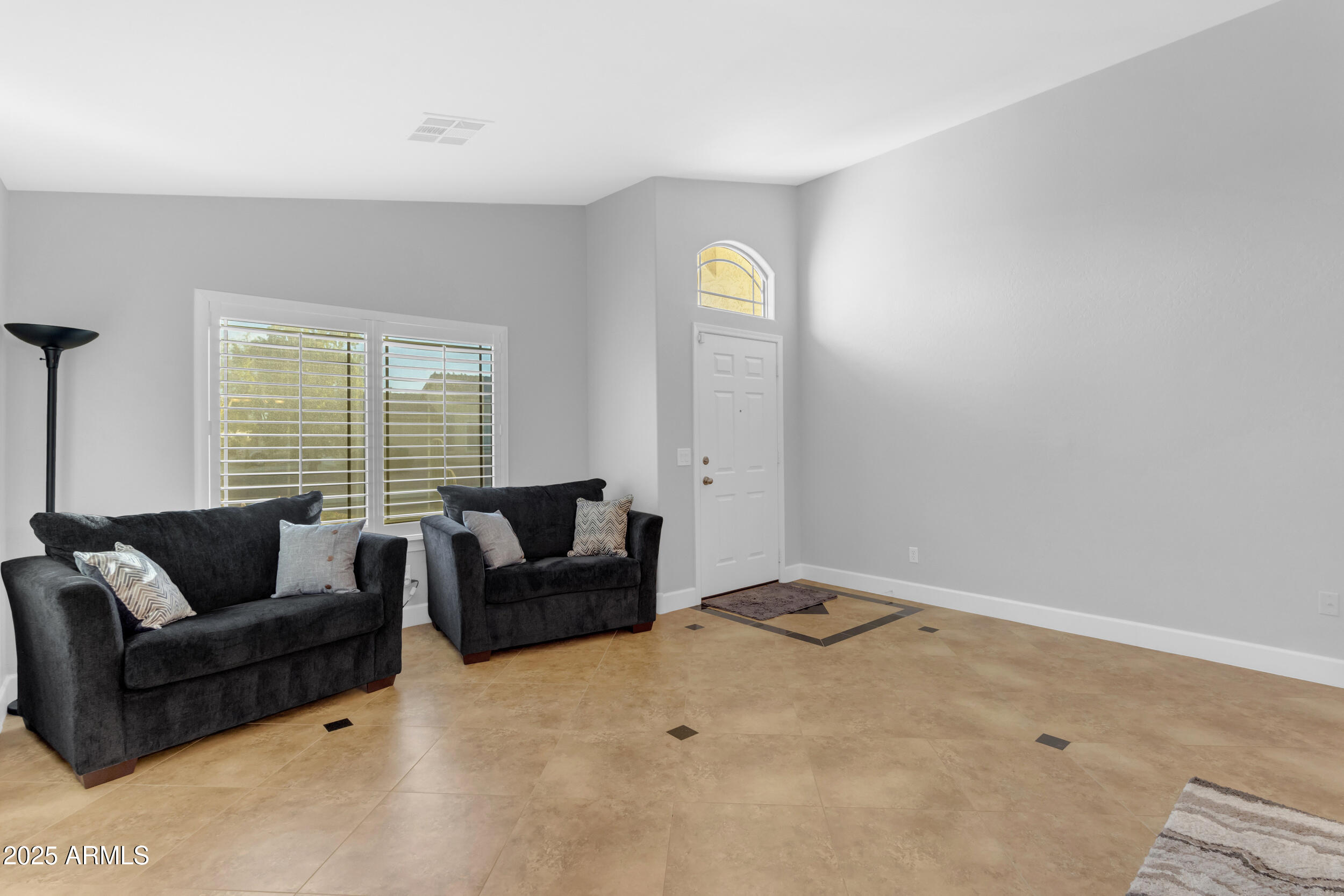 13438 West Redfield Road Surprise, AZ 85379 - Photo 15 of 75 a living room with furniture and a window