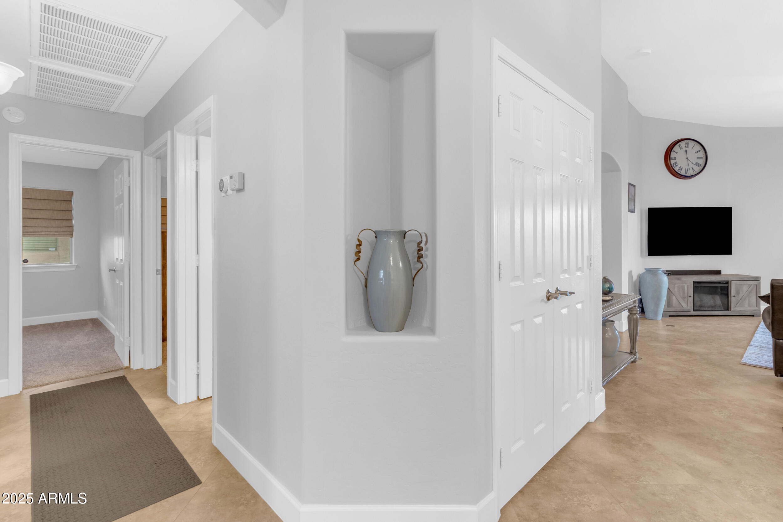 13438 West Redfield Road Surprise, AZ 85379 - Photo 26 of 75 a view of a hallway with front door and wooden floor