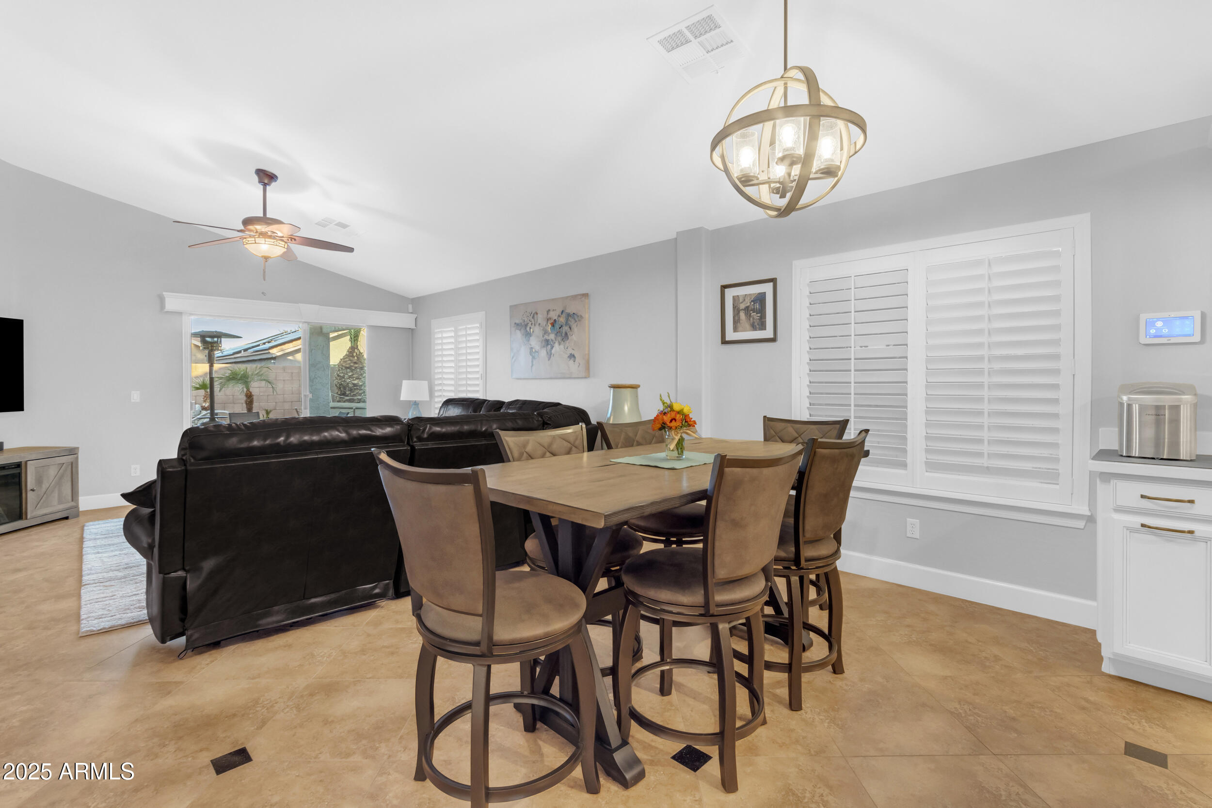 13438 West Redfield Road Surprise, AZ 85379 - Photo 27 of 75 a view of a dining room with furniture and chandelier