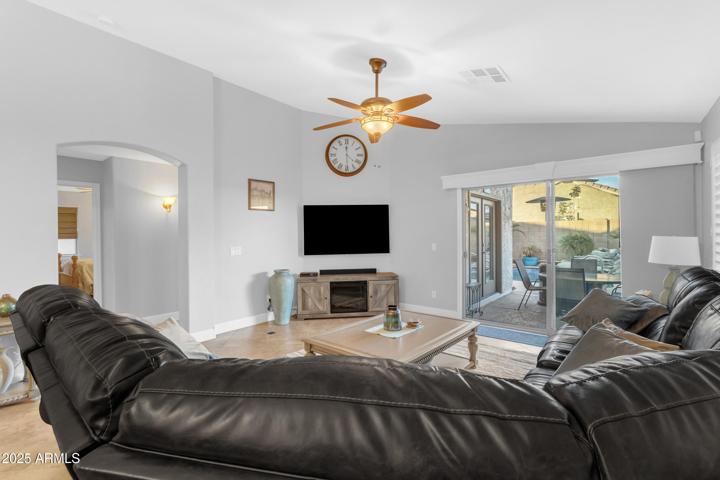 13438 West Redfield Road Surprise, AZ 85379 - Photo 31 of 75 a bedroom with a bed and a television