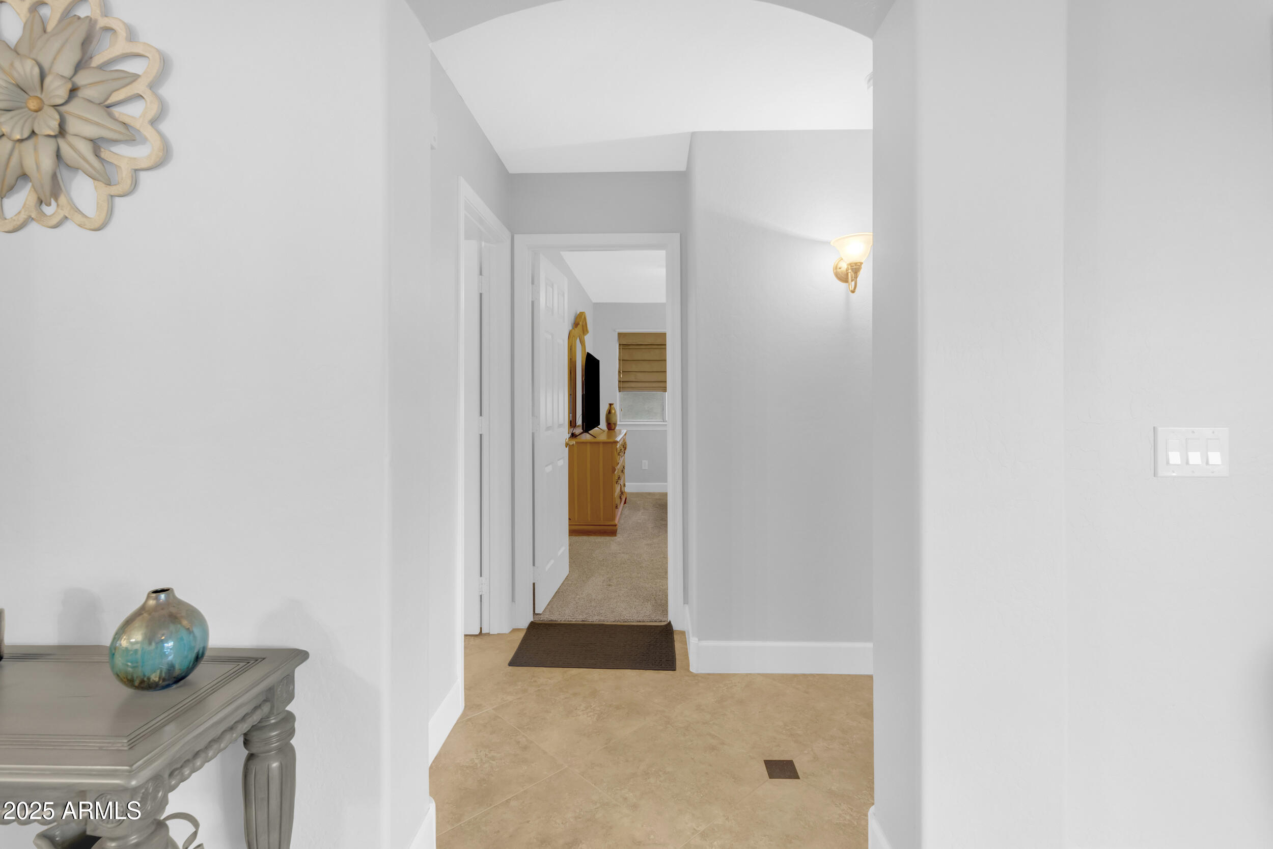 13438 West Redfield Road Surprise, AZ 85379 - Photo 35 of 75 a view of a bathroom from a hallway