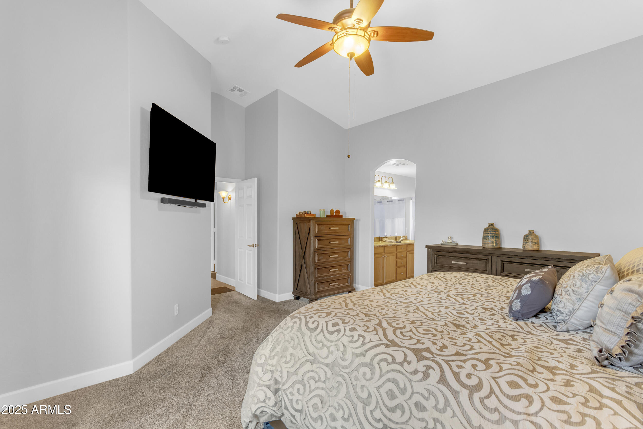 13438 West Redfield Road Surprise, AZ 85379 - Photo 37 of 75 a bedroom with a bed and a flat screen tv