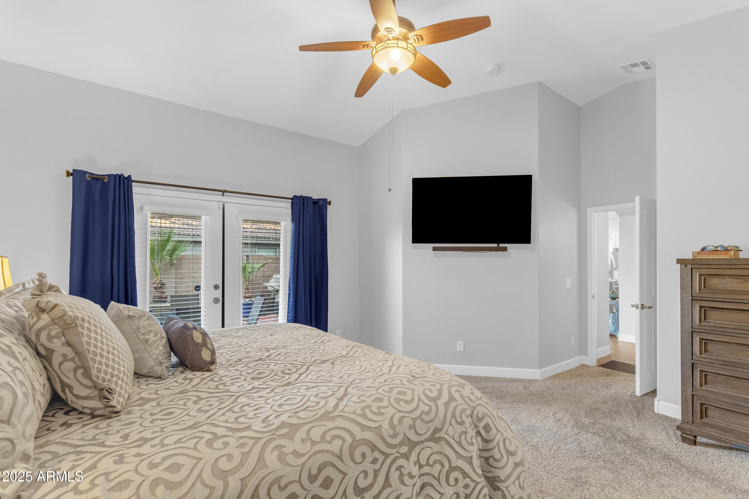 13438 West Redfield Road Surprise, AZ 85379 - Photo 38 of 75 a bedroom with a bed tv and a window