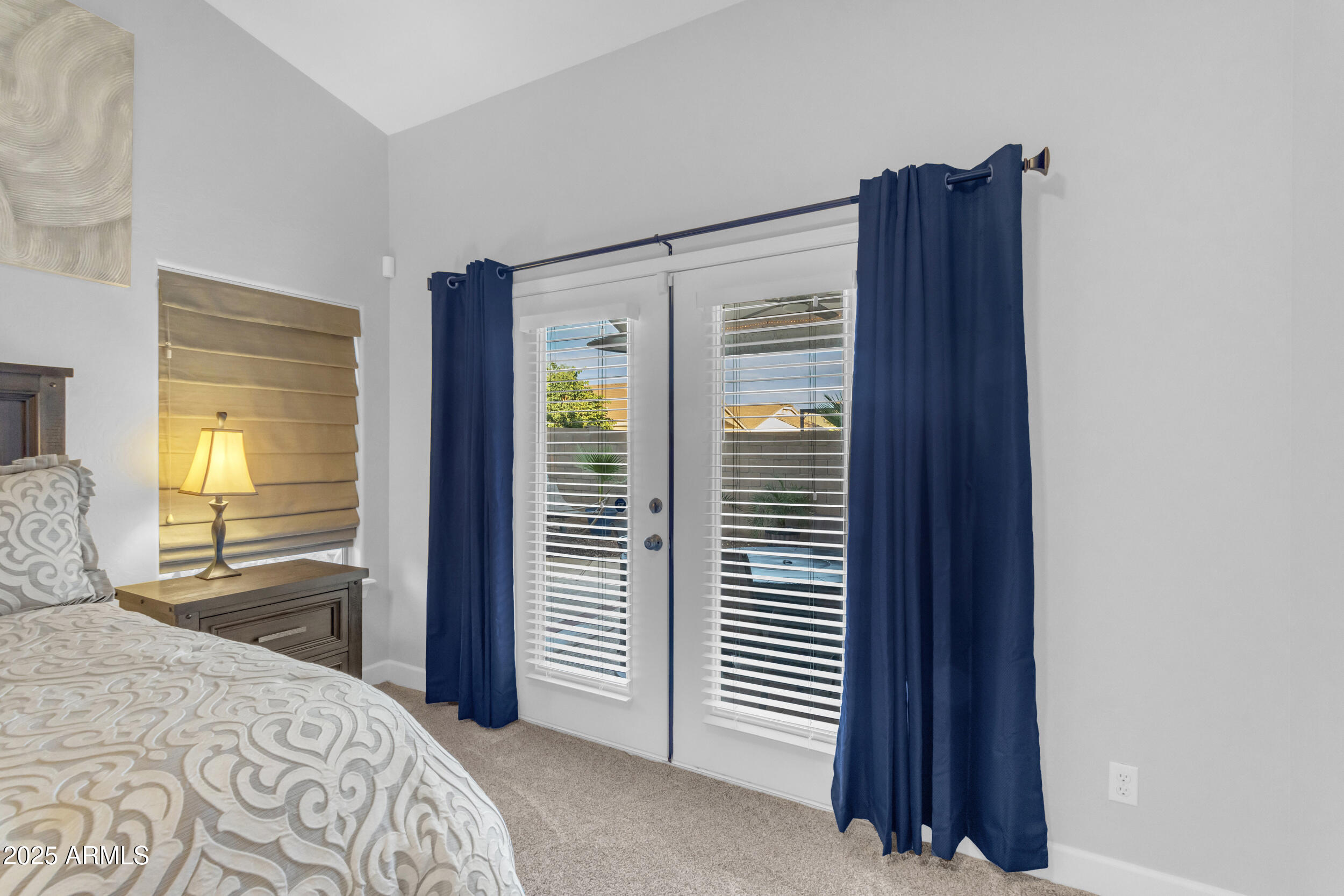 13438 West Redfield Road Surprise, AZ 85379 - Photo 39 of 75 a bedroom with a bed and a closet with mirror