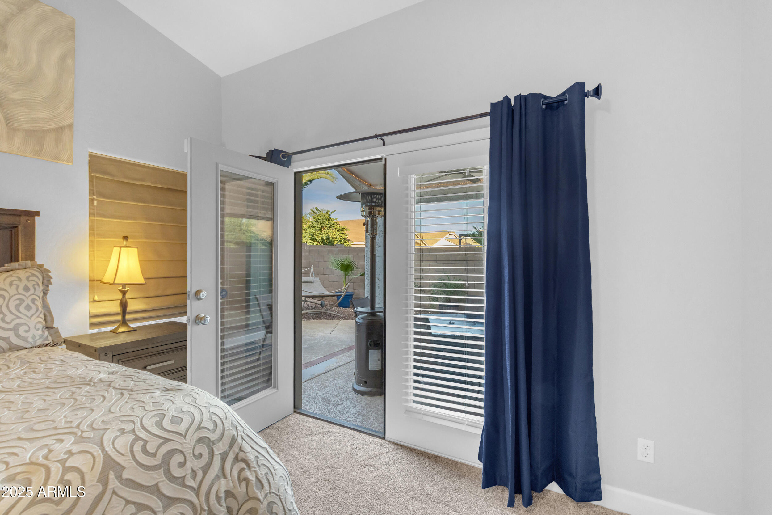 13438 West Redfield Road Surprise, AZ 85379 - Photo 40 of 75 a bedroom with a bed and a dresser